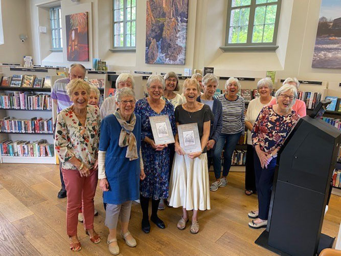 Members of the Blaenavon Heritage History Group holding copies of the Blaenavon: A Townscape Celebration book