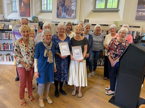 Members of the Blaenavon Heritage History Group holding copies of the Blaenavon: A Townscape Celebration book