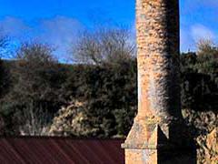 Ironmaking trail sign with Blaenavon Ironworks in the background