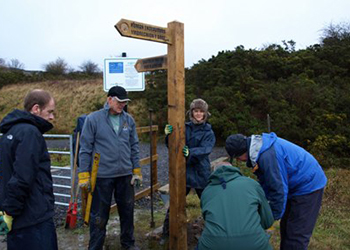 Volunteers installing waymarking