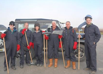 Volunteers preparing to burn heather