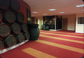 Many beer barrels on display at the Rhymney Brewery