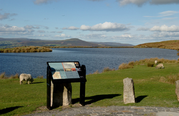 Keeper's Pond showing the lake and an information sign