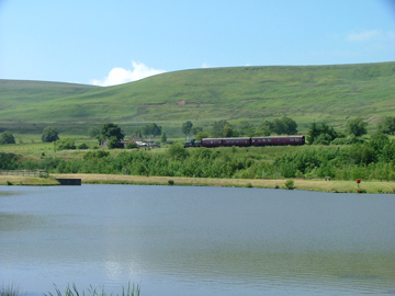 Garn Lakes, a train can be seen in the distance from across the lake